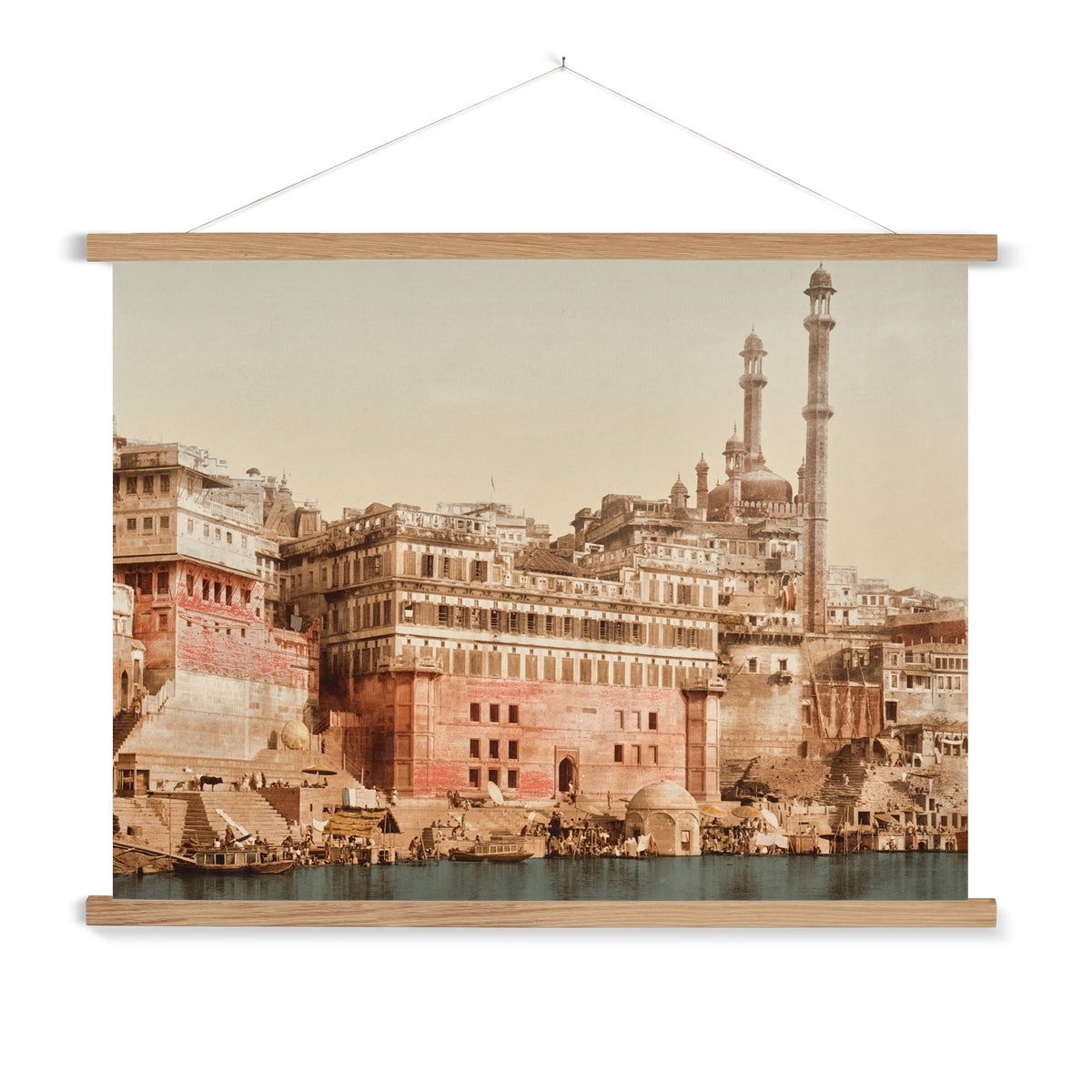 A vintage photo of a Mosque in Benares India, with a wooden hanger included. This print has a lovely soft patina and beautiful dusty colour palette.
A premium print + slimline wooden poster hanger with a discrete magnetic fastening to keep your prints perfectly secure. Hand-crafted from beautiful, solid wood, our picture hangers are ideal for displaying prints using a simple, contemporary design. When you want to update your style, simply change the print.
The Benares Mosque print features tan,