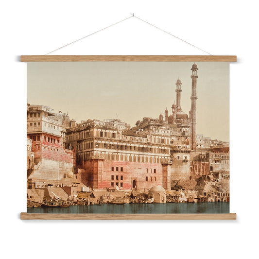 A vintage photo of a Mosque in Benares India, with a wooden hanger included. This print has a lovely soft patina and beautiful dusty colour palette.&nbsp;

A premium print + slimline wooden poster hanger with a discrete magnetic fastening to keep your prints perfectly secure. Hand-crafted from beautiful, solid wood, our picture hangers are ideal for displaying prints using a simple, contemporary design. When you want to update your style, simply change the print.
The Benares Mosque print features&nbsp;tan, 