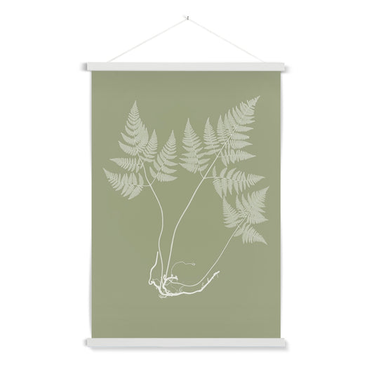 A delicate botanical study of a fern with a wooden hanger included. Part of a pair.

A premium print + slimline wooden poster hanger with a discrete magnetic fastening to keep your prints perfectly secure. Hand-crafted from beautiful, solid wood, our picture hangers are ideal for displaying prints using a simple, contemporary design. When you want to update your style, simply change the print.
The Eucalyptus Fern 2 print features green and ivory.
+ Free International Shipping.