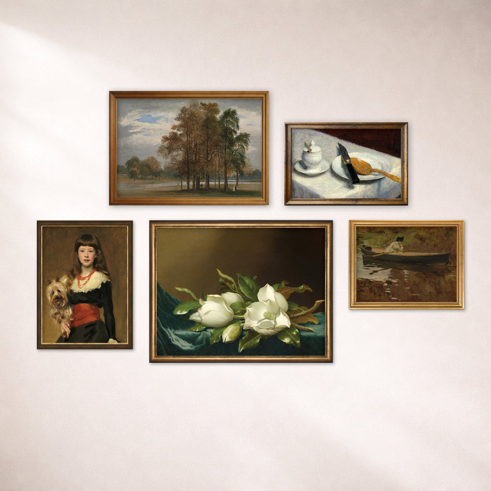 Collection of framed paintings on a wall