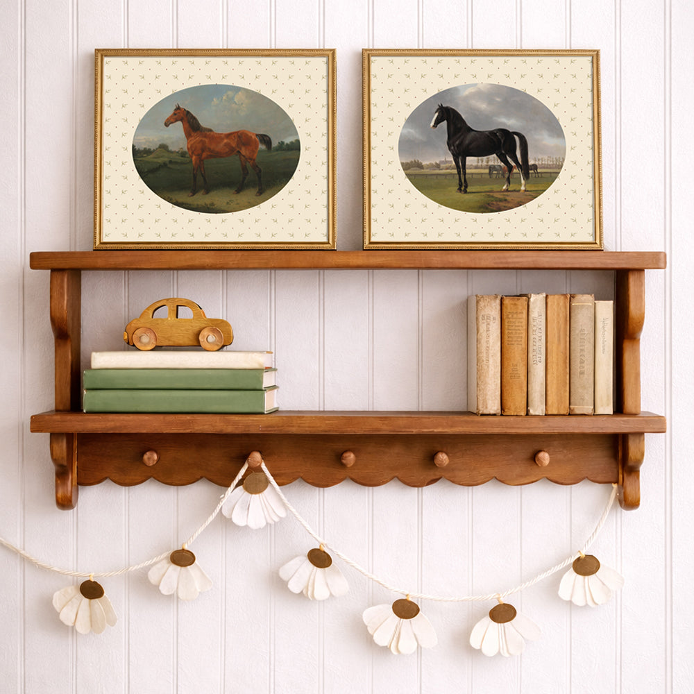 A sweet oval framed vintage print of a black horse, set upon a botanical pattern background. Part of a pair. Perfect for a Cottage core Interior aesthetic.


