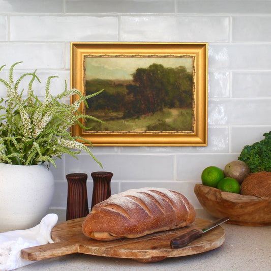 A ready to hang, vintage painting printed onto canvas and framed in a beautiful gold textured frame. Moody View is one of three framed canvas prints available as part of our kitchen shelfie series.